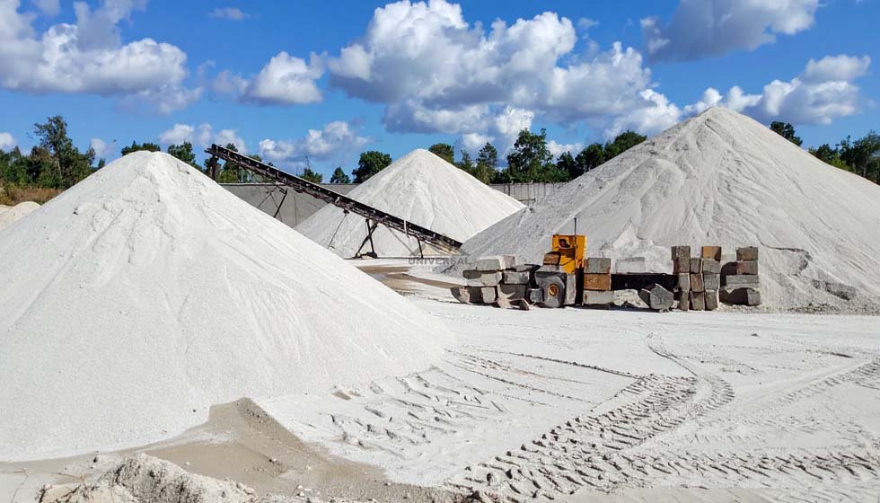 Mountains of white silica sand